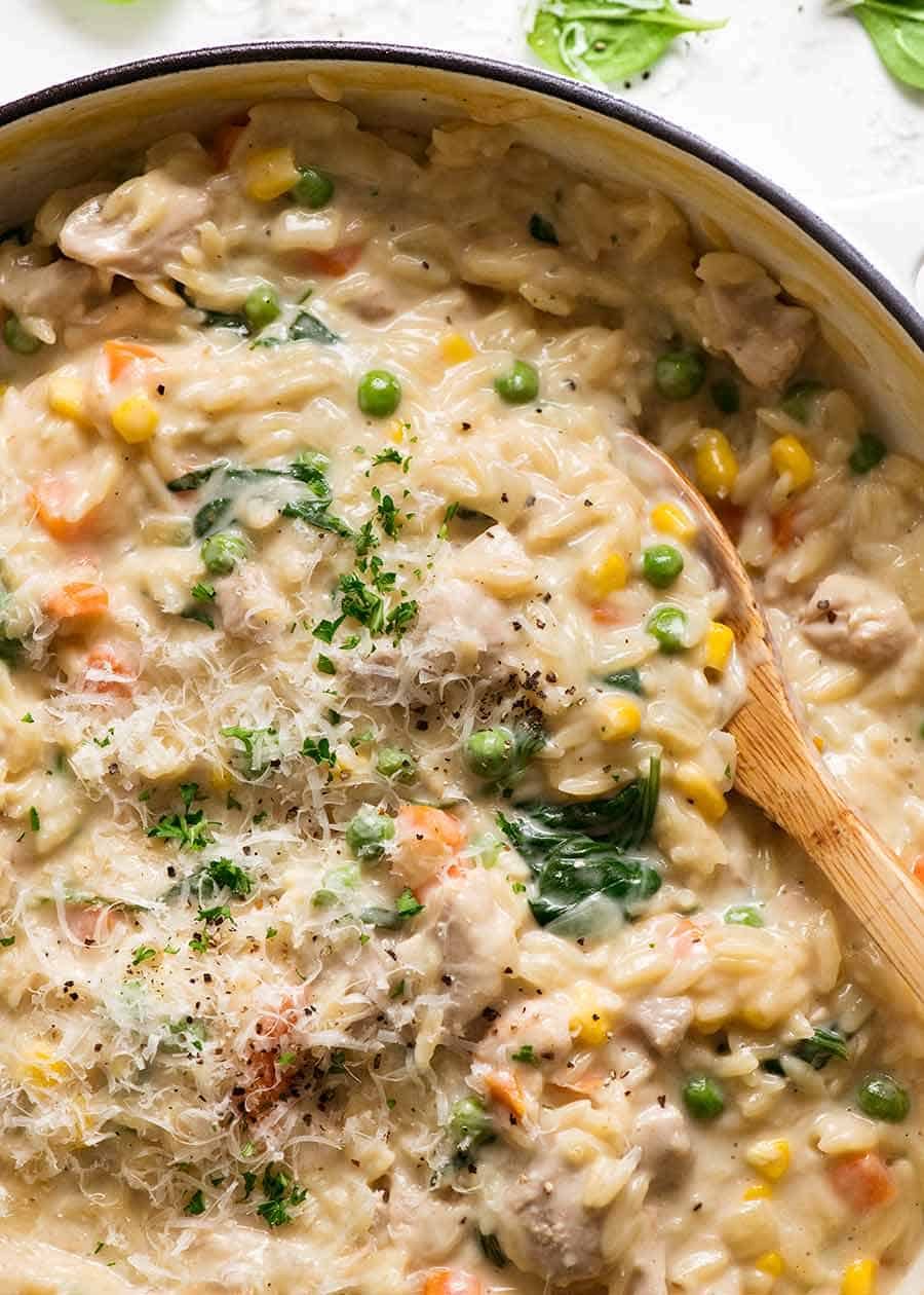 Creamy Chicken Vegetable Risoni in a skillet, fresh off the stove. Quick one pot risoni recipe - 15 minutes!
