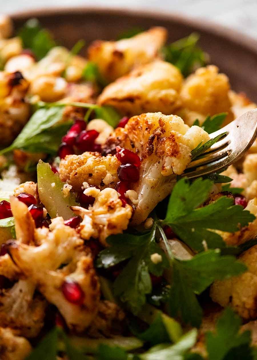 Close up of fork picking up Cauliflower Salad