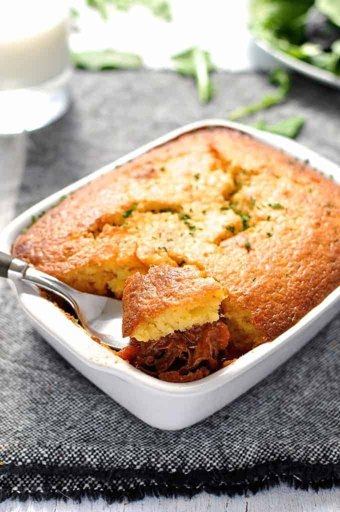 Chili Con Carne Corn Bread Pie in white baking dish