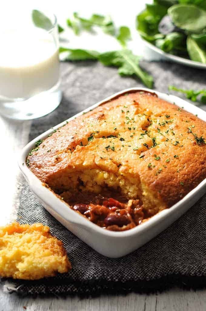 Chili Con Carne Corn Bread Pie in white baking dish