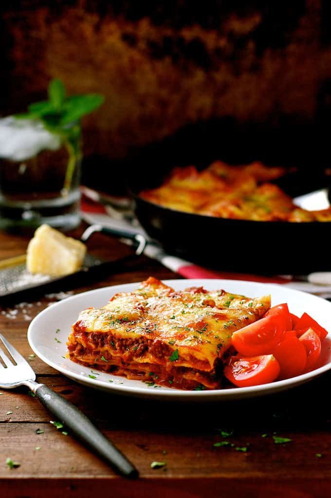 Plated One Pot Lasagna with tomatoes on the side