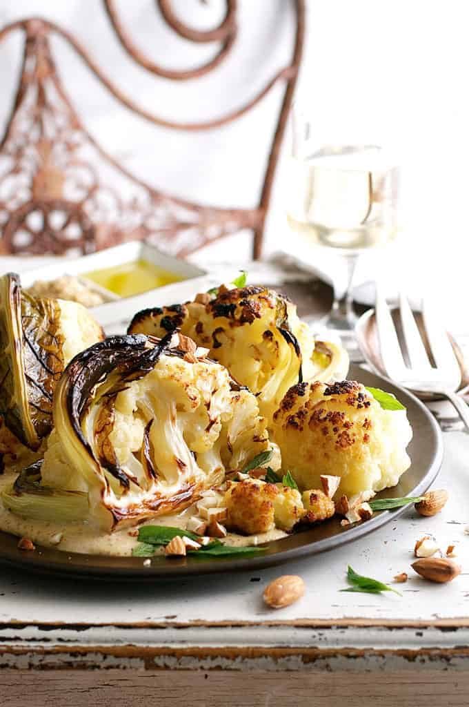 Ester's Roasted Cauliflower with Almond Sauce on dark plate
