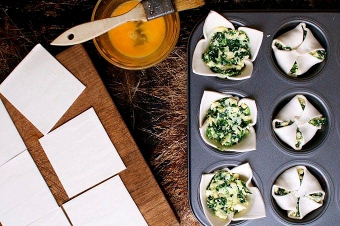 Preparing Ricotta and Spinach Puff Pastry Bites in muffin tray