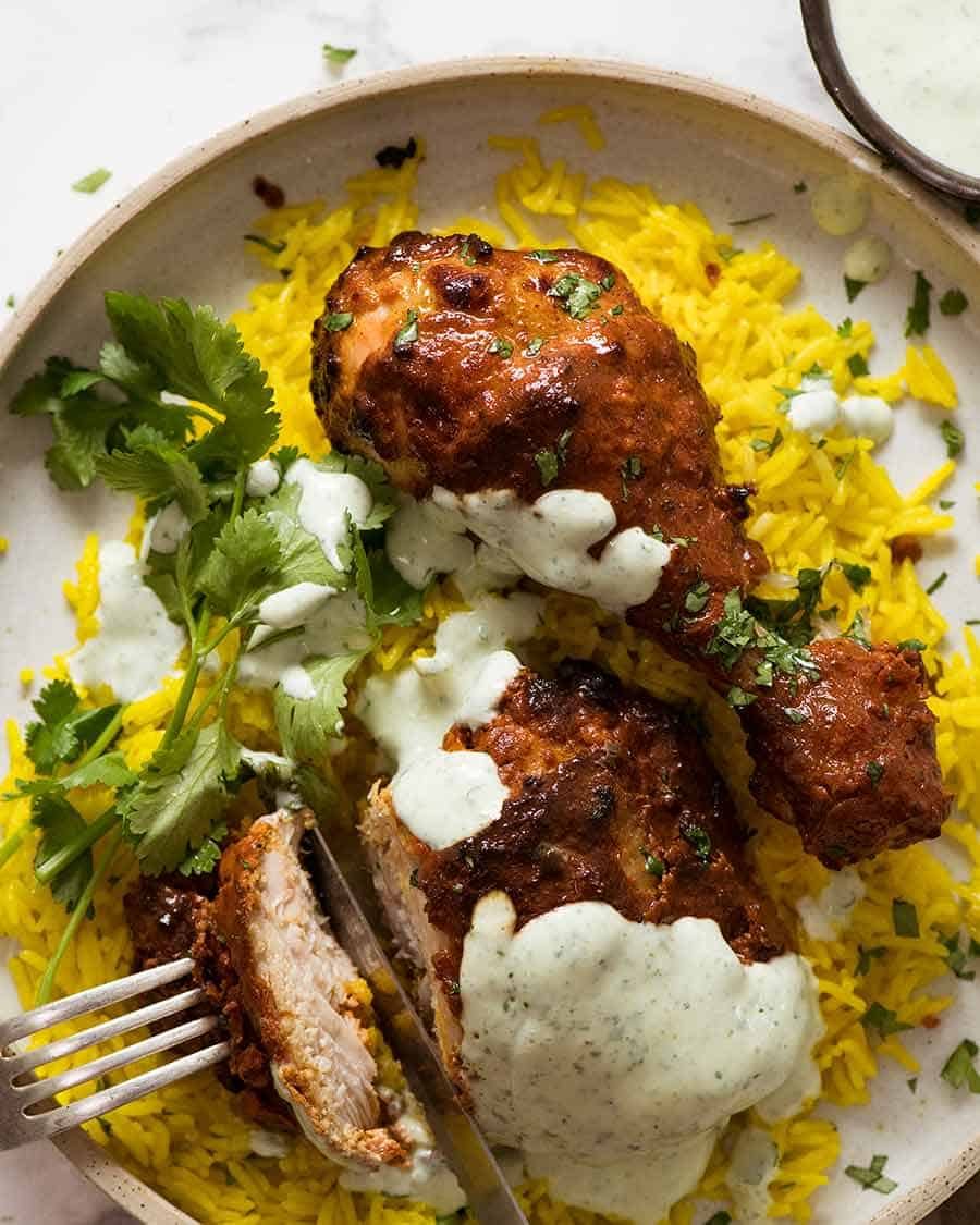 Tandoori Chicken served with saffron rice and minted yogurt sauce
