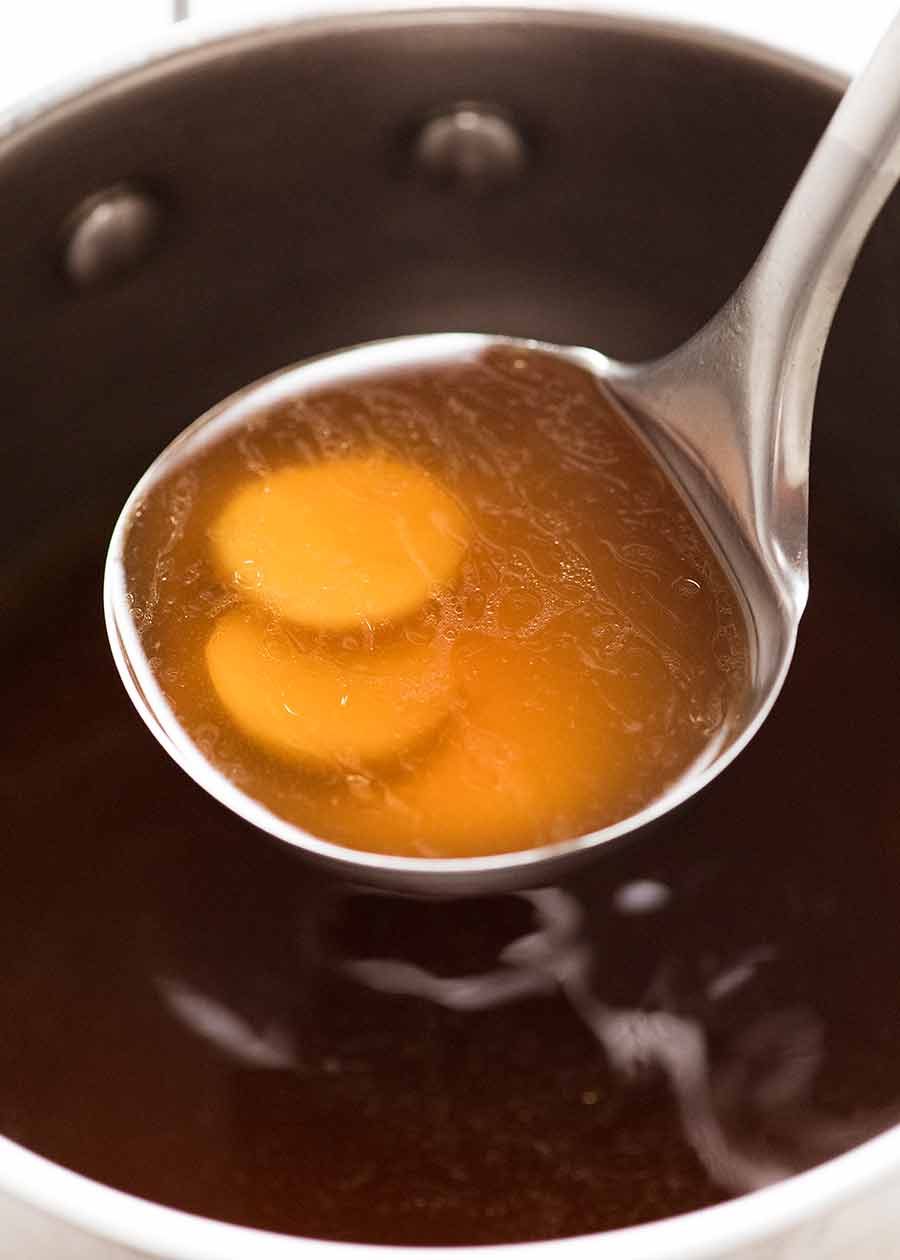 Ladle of Chinese Noodle Soup Broth