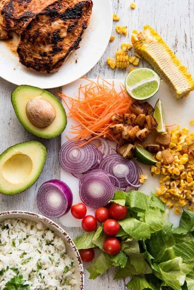 A salad with chicken marinated in pineapple juice, coconut milk & spices and a beautiful cilantro (coriander) lime dressing. The flavours of Hawaii - in a salad! recipetineats.com