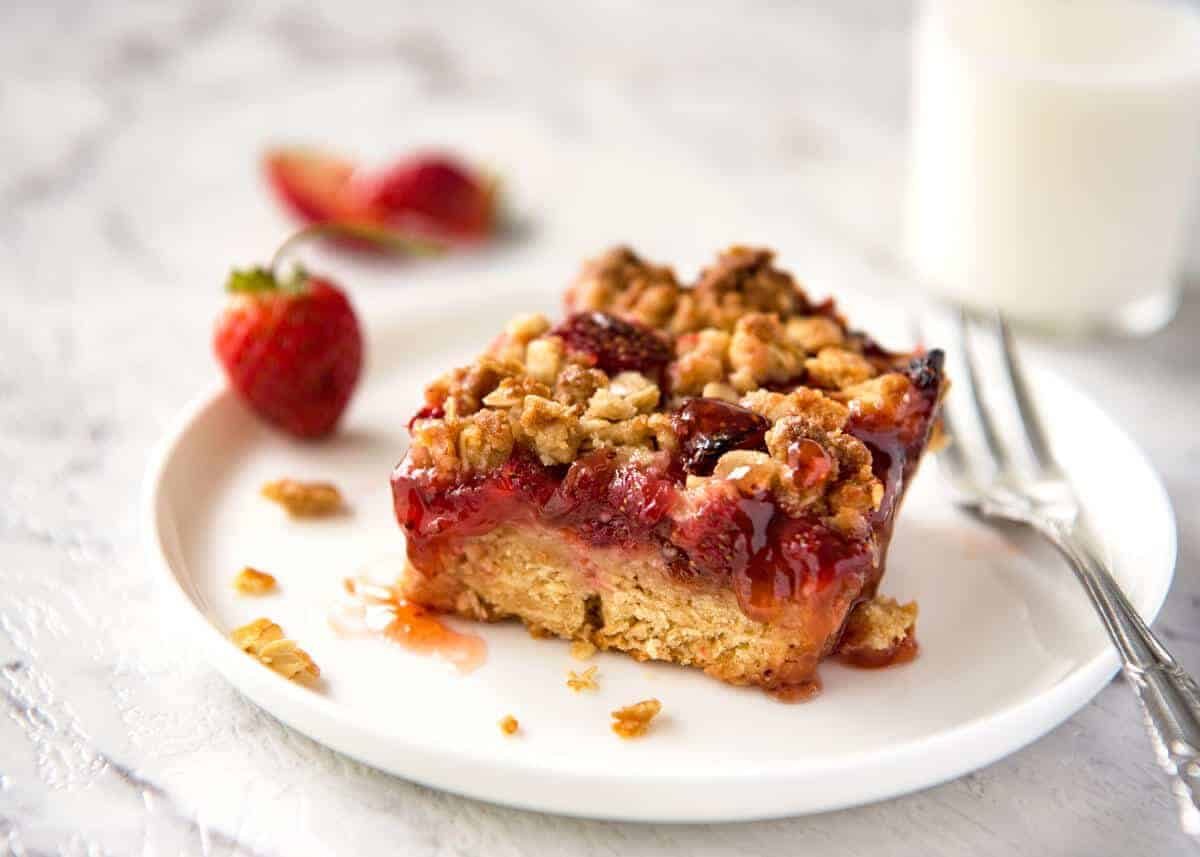 Fresh Strawberry Bars with a buttery biscuit base, topped with jam, fresh strawberries and a crumbly topping. No mixer, quick to make! www.recipetineats.com