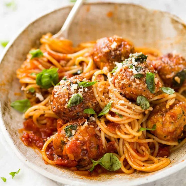 Plump, juicy BAKED Chicken Meatballs and Spaghetti! They come out golden brown on the outside, and so soft and juicy on the inside. recipetineats.com