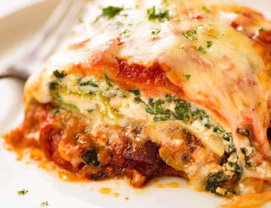 Vegetarian Lasagna on a white plate, ready to be eaten