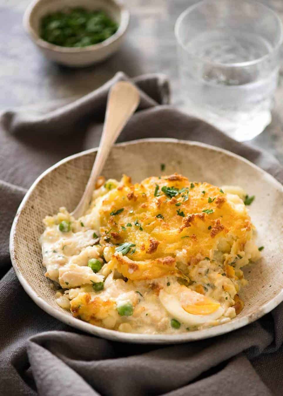 Fish pie in rustic brown serving bowl