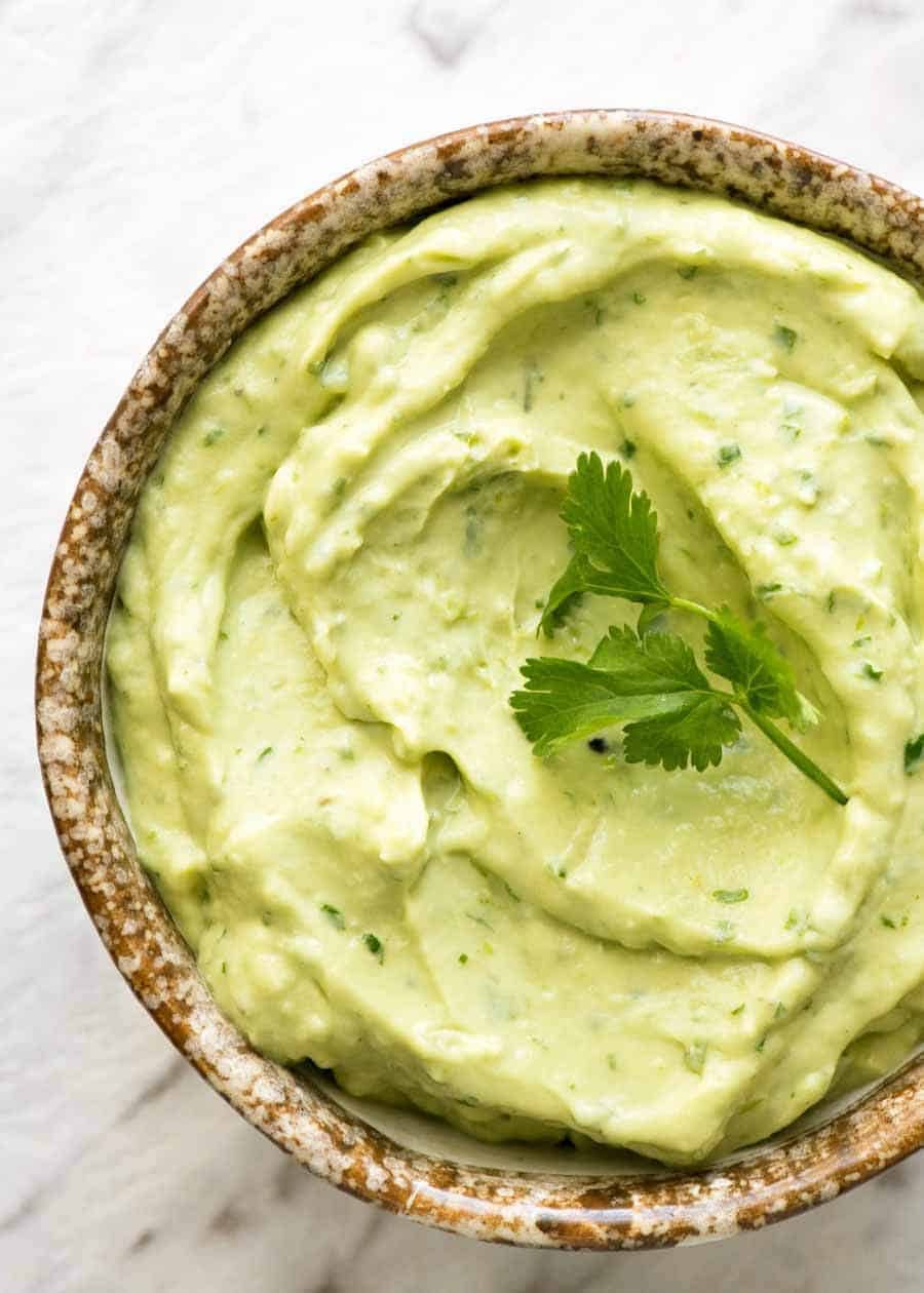 Overhead photo of Avocado Sauce in a rustic bowl.