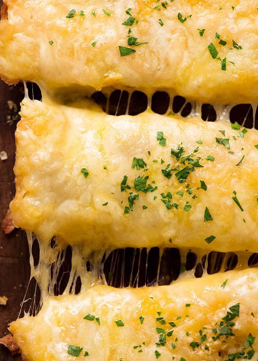 Close up overhead photo of Quick Cheesy Garlic Bread with stretchy cheese, fresh out of the oven