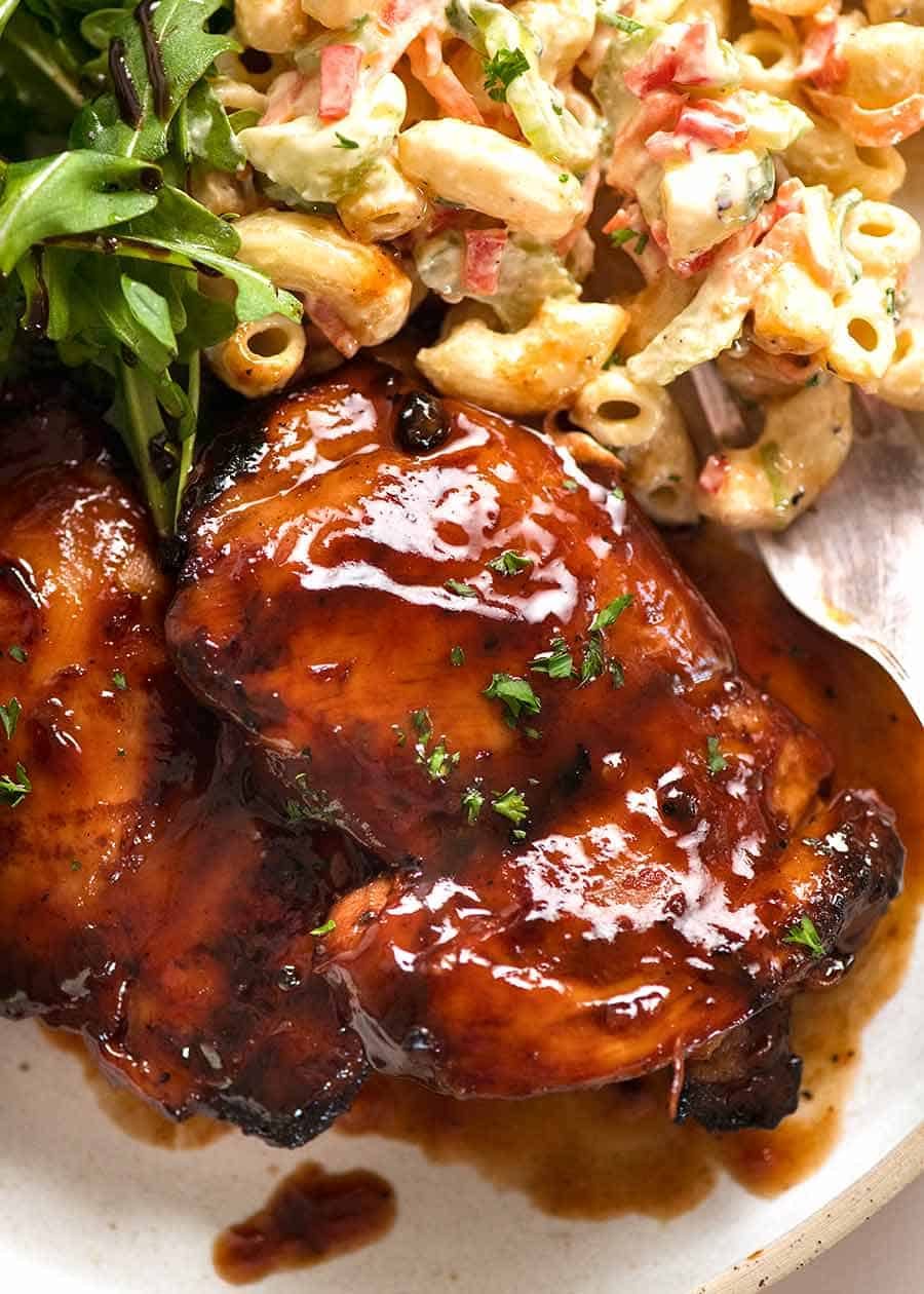 Sticky Grilled Chicken in a plate with a side of Macaroni Salad and Rocket Salad