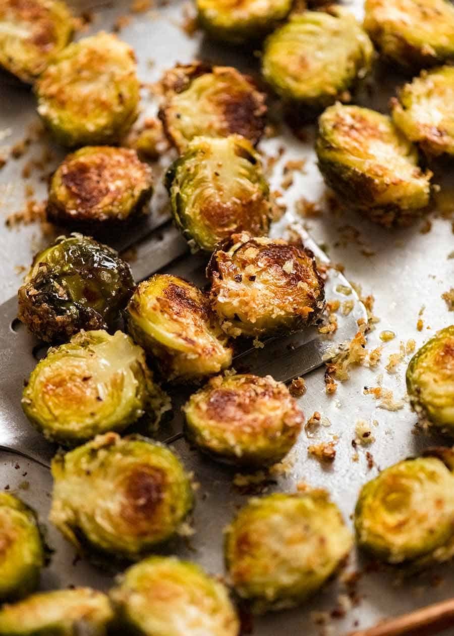 CRISPY Parmesan Garlic Roasted Brussels sprouts recipe on a tray, fresh out of the oven