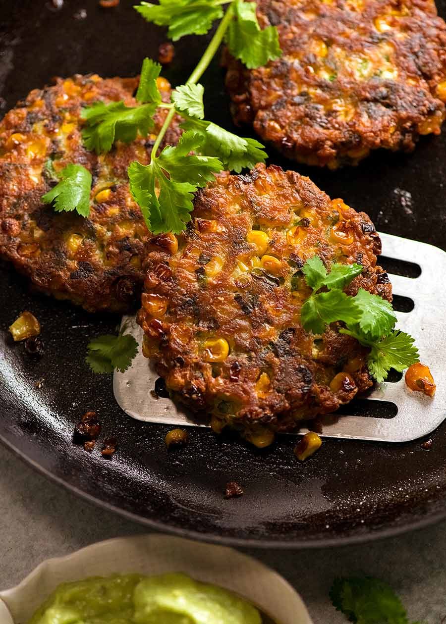 Freshly cooked Crispy Corn Fritters in a skillet