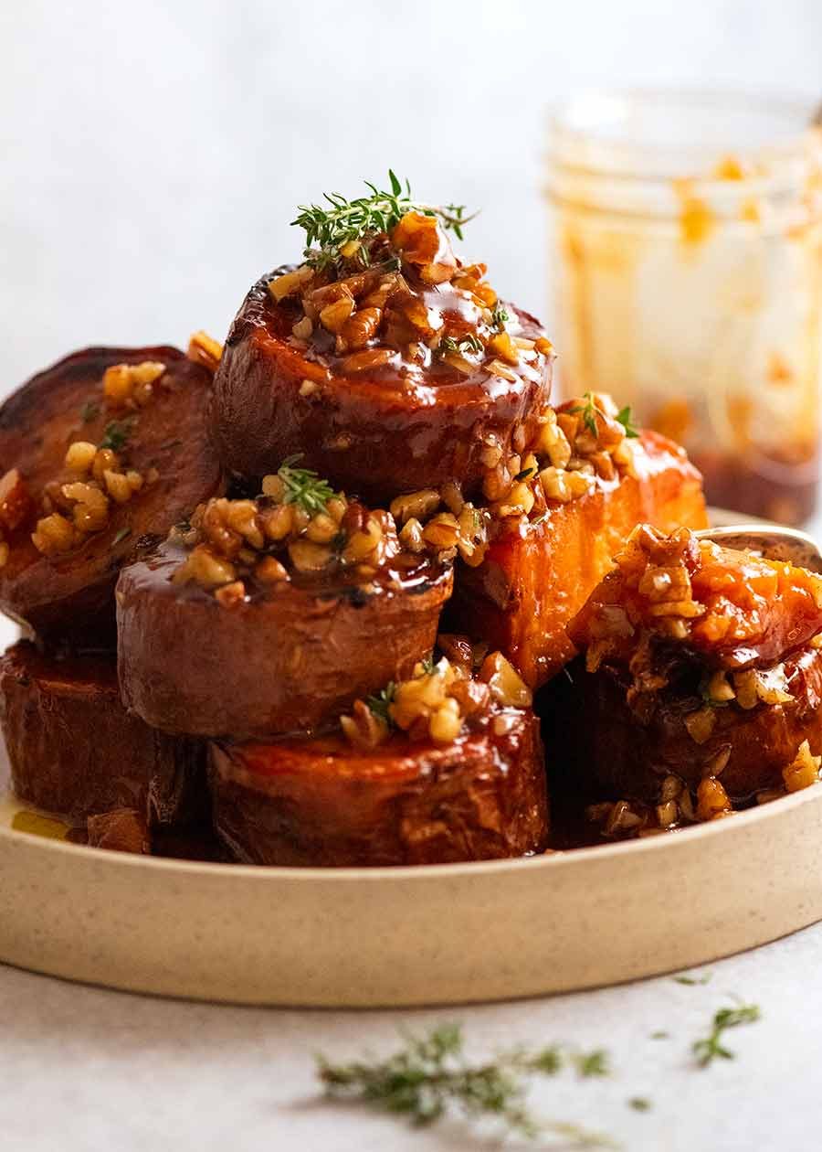 Fondant Sweet Potatoes with Maple Butter piled up on a plate, ready to be served