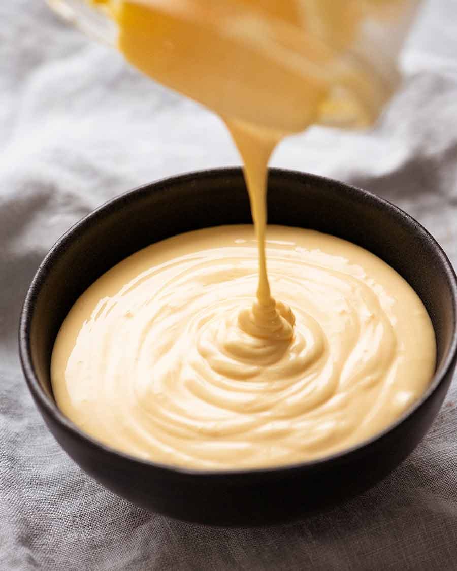 Hollandaise Sauce being poured into bowl