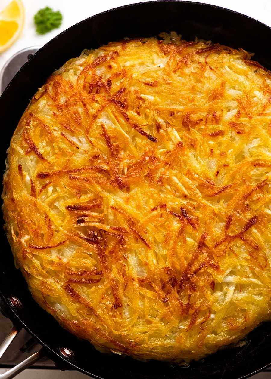 Potato Rosti in a skillet, fresh off the stove