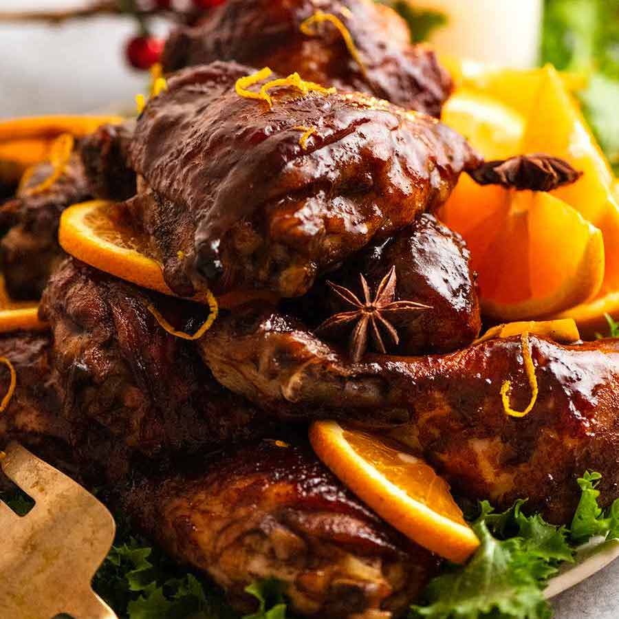 Close up of pile of Sticky Glazed Christmas Chicken