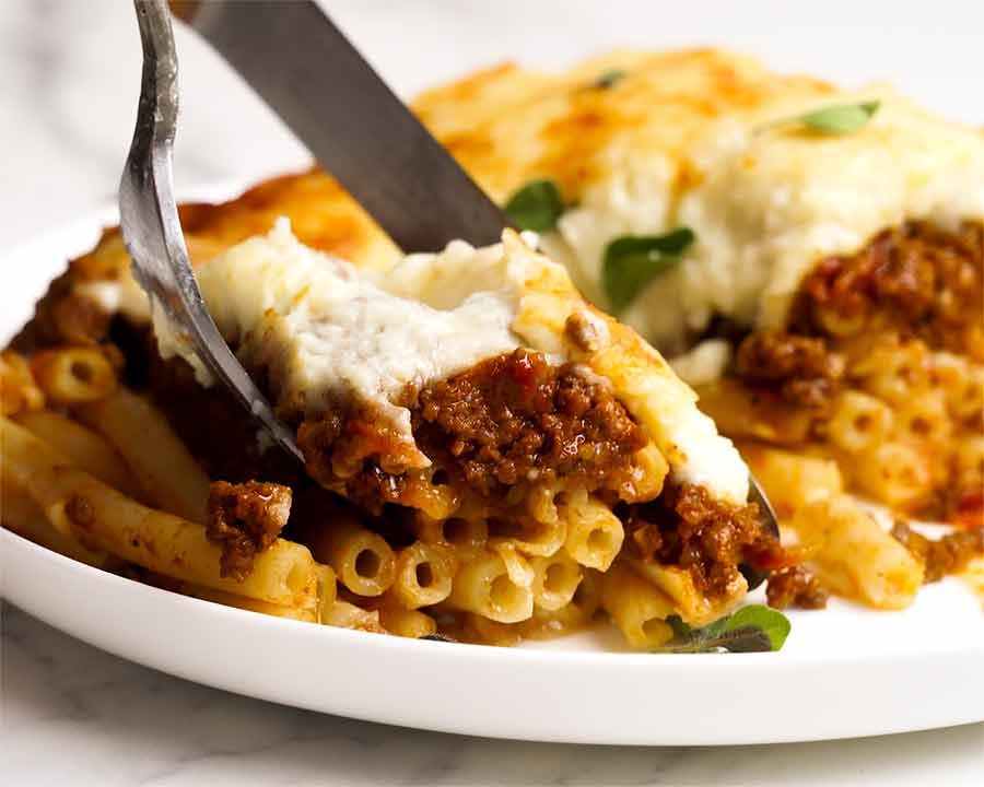 Close up of fork eating Pastitsio (Greek pasta bake)