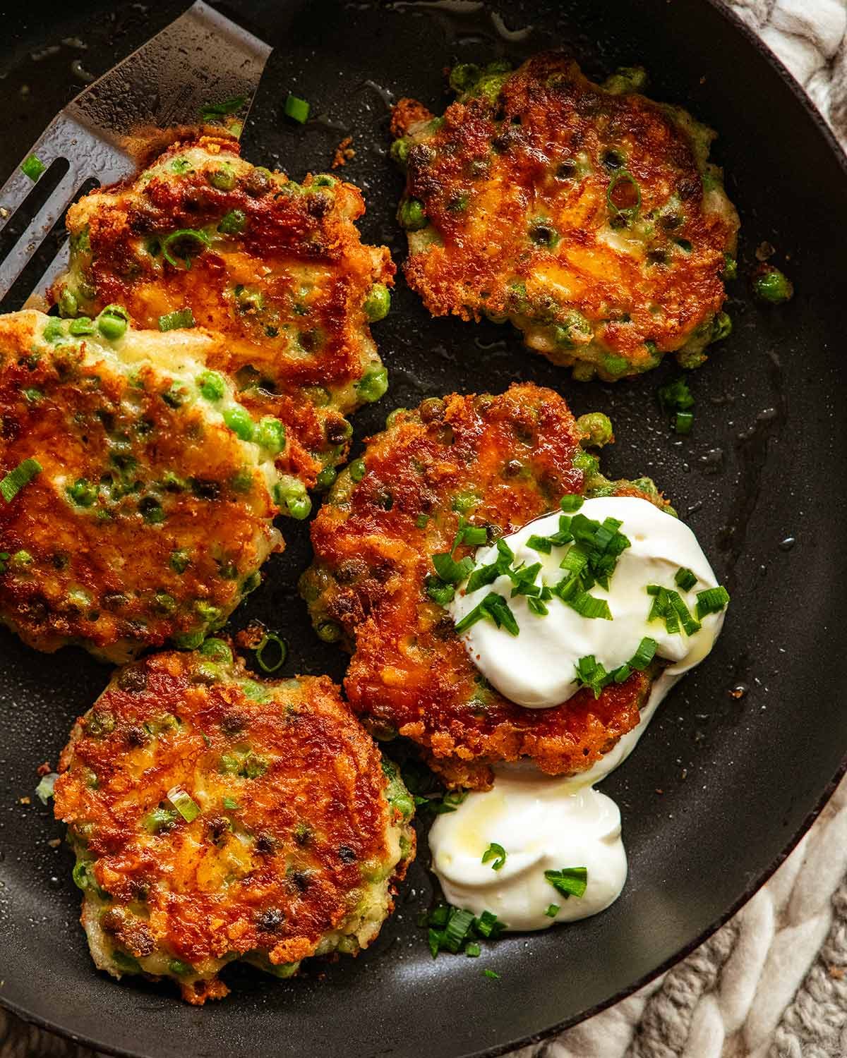 Crispy pea fritters in a pan