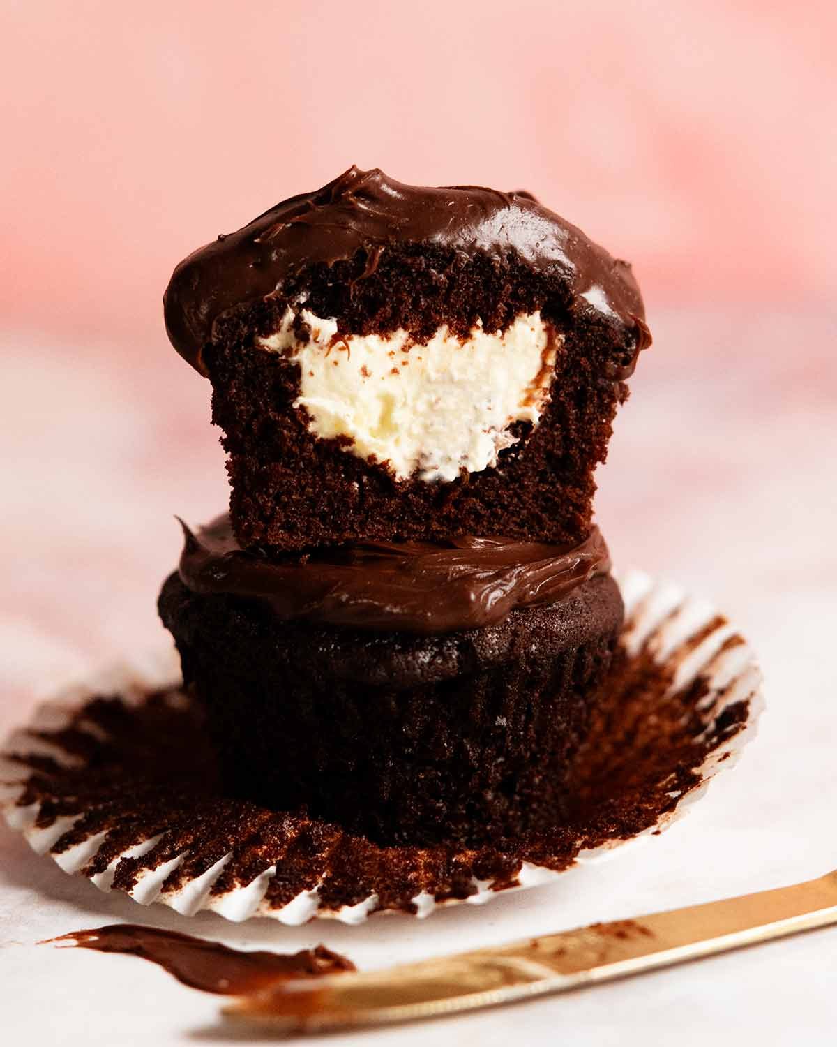 Whipped vanilla cream filled chocolate cupcakes with ganache frosting
